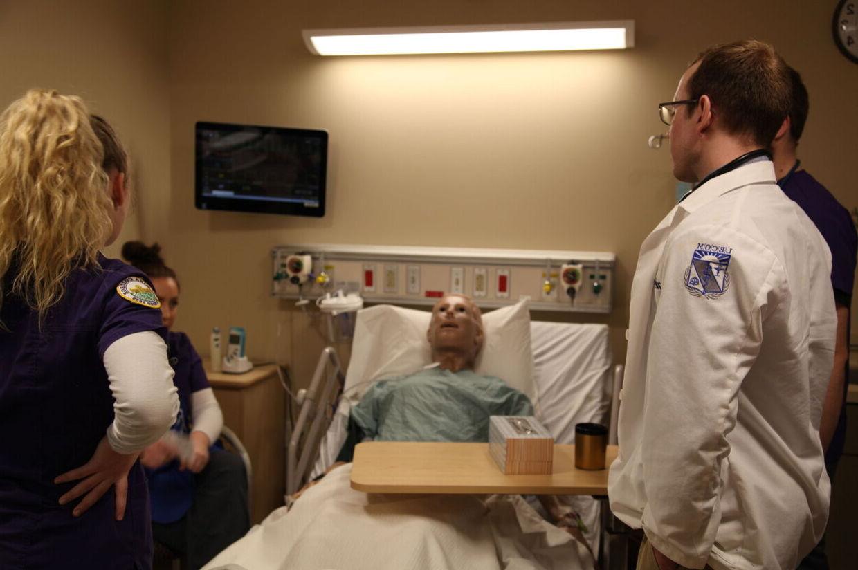Nursing and LECOM students practice caring for a patient